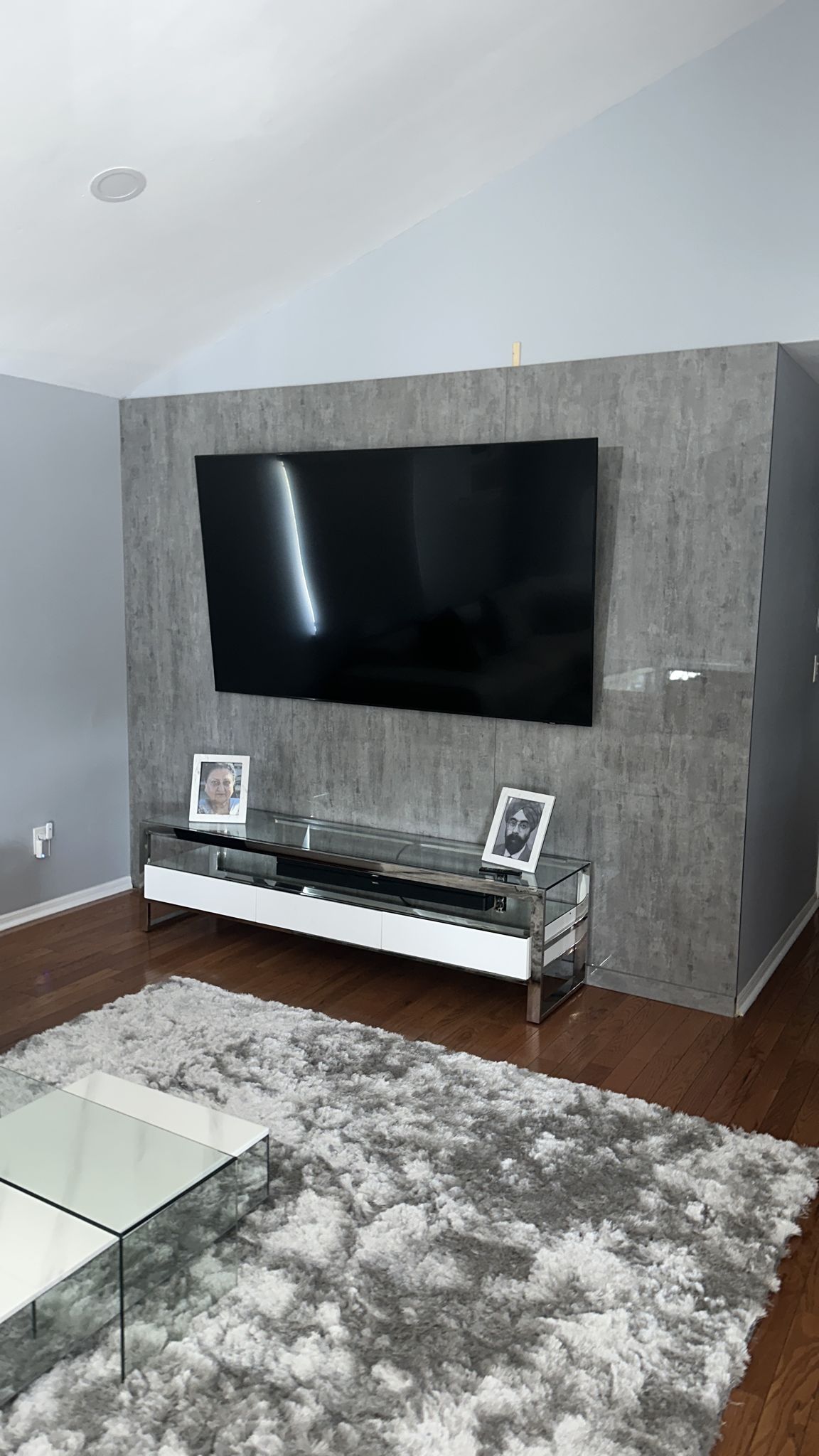 Urban Cement sample 022 used as a full-height television feature wall in a finished living room