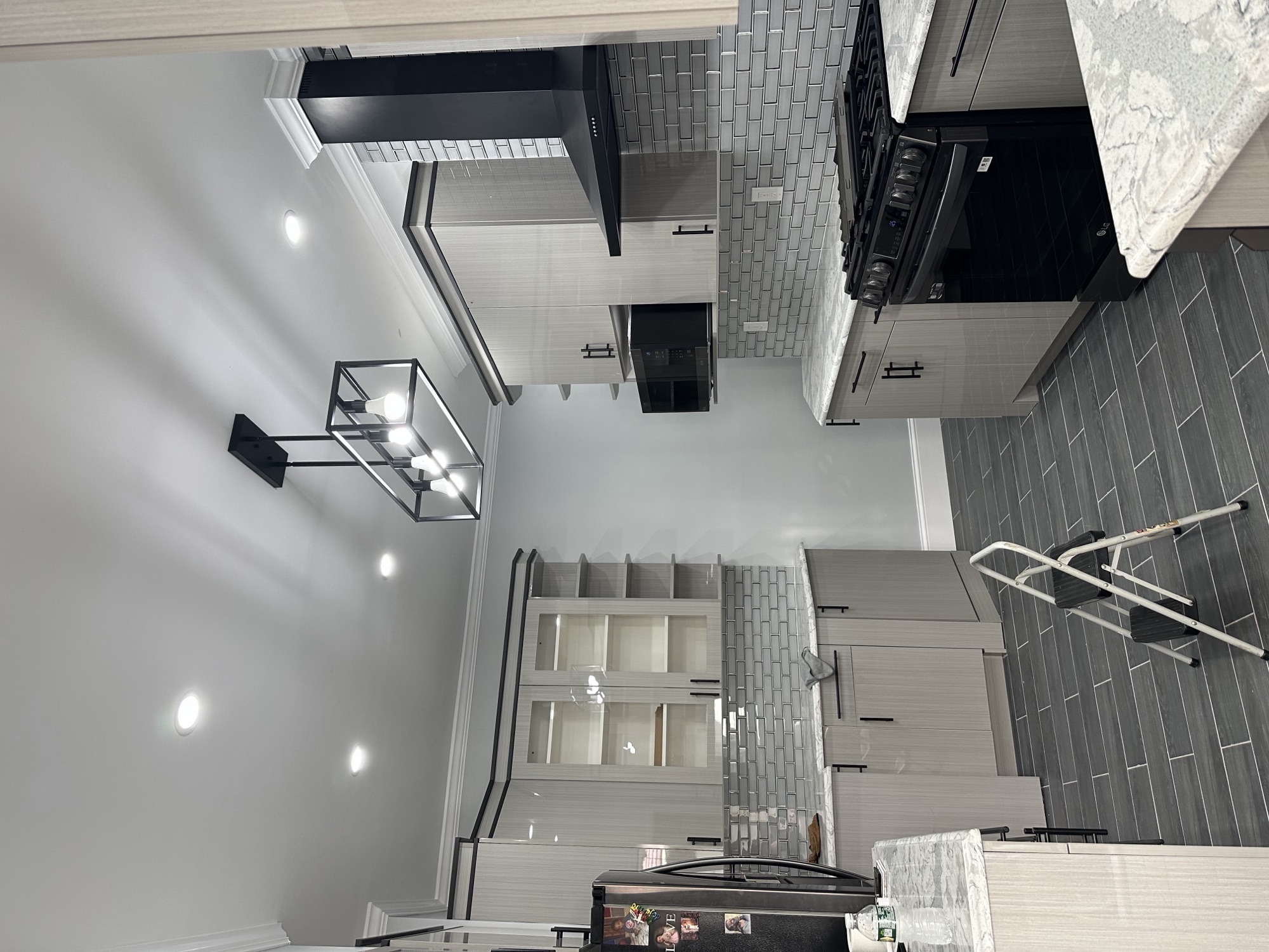Wide view of a completed kitchen using Silver Reed sample 067 cabinetry