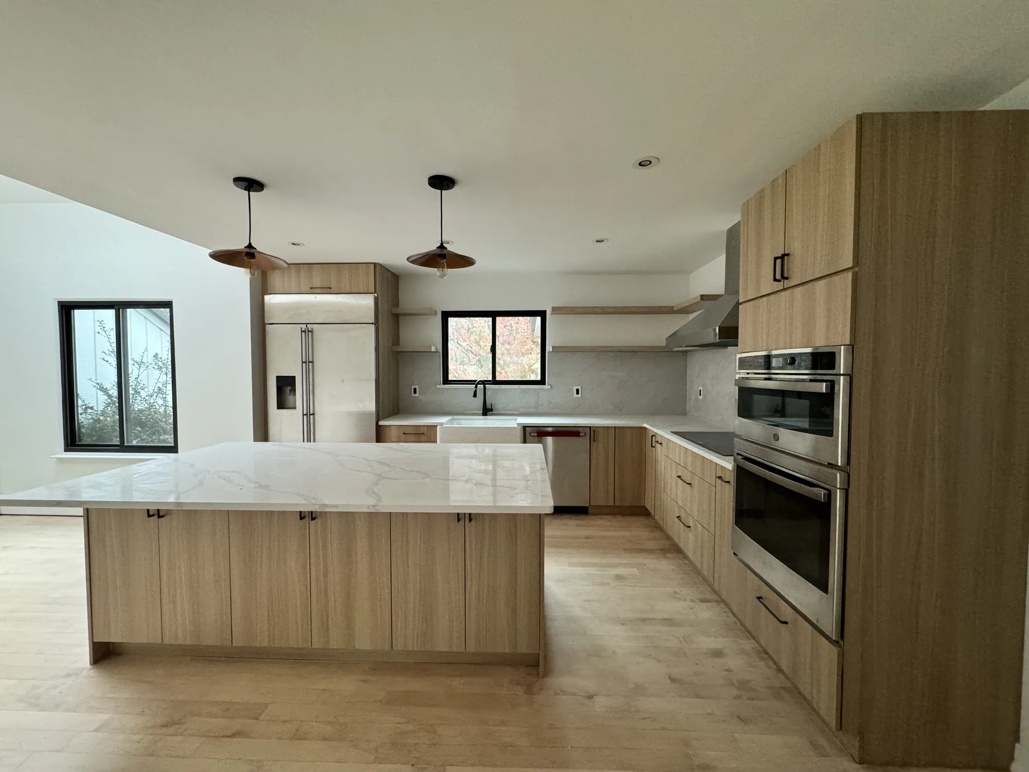 Light wood custom kitchen with large island